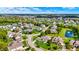 An aerial view of a neighborhood with a scenic pond and lush green landscaping at 14458 Smickle Ln, Carmel, IN 46033