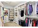 The walk-in closet has custom shelving and hanging racks for storing clothes and shoes at 14458 Smickle Ln, Carmel, IN 46033