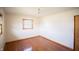 Bedroom with hardwood floors and a bright window at 1460 W Mckay Rd, Shelbyville, IN 46176