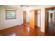 Well-lit bedroom boasting hardwood floors, closet, and a window offering natural light at 1460 W Mckay Rd, Shelbyville, IN 46176