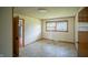 Cozy bedroom with painted paneling, a window, and linoleum flooring at 1460 W Mckay Rd, Shelbyville, IN 46176