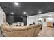Finished basement with plush seating, perfect for relaxation and entertainment at 14918 E 206Th St, Noblesville, IN 46060