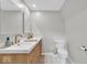 Well-lit bathroom featuring a modern vanity with wood accents and fixtures at 14918 E 206Th St, Noblesville, IN 46060