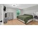 Cozy bedroom with hardwood floors, large window, and neutral decor at 14918 E 206Th St, Noblesville, IN 46060