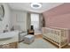 Adorable Bedroom featuring a crib, rocking chair, changing table, and soft colors at 14918 E 206Th St, Noblesville, IN 46060