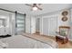Spacious bedroom with hardwood floors, closet, ensuite bathroom, and stylish decor at 14918 E 206Th St, Noblesville, IN 46060