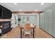 Dining room featuring a fireplace, natural lighting, and hardwood floors throughout at 14918 E 206Th St, Noblesville, IN 46060