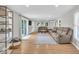 Bright living room featuring hardwood floors, recessed lighting, and sliding glass doors at 14918 E 206Th St, Noblesville, IN 46060