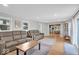 Open concept living room boasting hardwood floors and seamless flow to the dining area at 14918 E 206Th St, Noblesville, IN 46060