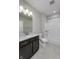 Bathroom features a granite vanity, tub-shower combination with white tile, and updated fixtures at 16774 Imperial Ct, Fishers, IN 46040