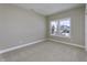Cozy bedroom with neutral carpet, paint, and a large window providing natural light at 16774 Imperial Ct, Fishers, IN 46040