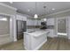 Stylish kitchen with white cabinets, stainless steel appliances, and a functional center island at 16774 Imperial Ct, Fishers, IN 46040