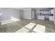 Open-concept living space featuring hardwood floors, neutral walls, and a seamless transition to the kitchen at 16774 Imperial Ct, Fishers, IN 46040