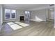Open living room with hardwood floors, fireplace, and natural light creates a bright and airy atmosphere at 16774 Imperial Ct, Fishers, IN 46040