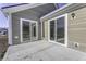 Back patio with 2 sliding glass doors and an exterior sconce at 16774 Imperial Ct, Fishers, IN 46040