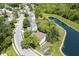 Aerial view of a house next to a large pond, with mature trees at 17635 Willow Creek Way, Westfield, IN 46074