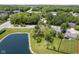 Aerial view featuring home next to pond, grass, and mature trees at 17635 Willow Creek Way, Westfield, IN 46074