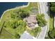 Aerial view of a home with a pond and lush landscaping, offering a private and serene setting at 17635 Willow Creek Way, Westfield, IN 46074