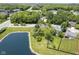 Aerial view featuring a lake and neighborhood with mature trees at 17635 Willow Creek Way, Westfield, IN 46074