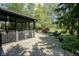 Charming screened-in porch adjacent to a brick patio and lush backyard at 17635 Willow Creek Way, Westfield, IN 46074