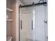 Updated bathroom showcasing a modern shower with glass doors and subway tile at 17635 Willow Creek Way, Westfield, IN 46074