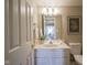 Bathroom with vanity, sink, mirror, and picture frame at 17635 Willow Creek Way, Westfield, IN 46074