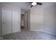 Cozy carpeted bedroom features a ceiling fan and closet with double doors at 17635 Willow Creek Way, Westfield, IN 46074