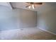 A neutral-toned bedroom featuring plush carpeting and a ceiling fan at 17635 Willow Creek Way, Westfield, IN 46074