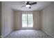 Bedroom featuring soft carpeting, a ceiling fan, and a large window at 17635 Willow Creek Way, Westfield, IN 46074