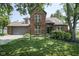 Beautiful brick home with a manicured lawn, mature trees, and an attached two-car garage at 17635 Willow Creek Way, Westfield, IN 46074