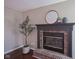 Cozy brick fireplace with a decorative mantel and hearth, creating a warm and inviting focal point at 17635 Willow Creek Way, Westfield, IN 46074