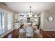 Bright kitchen features white cabinets, stainless appliances, island with breakfast bar, and a dining area at 17635 Willow Creek Way, Westfield, IN 46074
