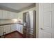 This kitchen features white cabinets, stainless appliances, hardwood floors, and a pantry at 17635 Willow Creek Way, Westfield, IN 46074