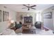 Cozy living room features a fireplace, ceiling fan, and comfortable seating at 17635 Willow Creek Way, Westfield, IN 46074
