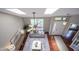 Upper view of a well-lit living room featuring hardwood floors, skylights, and stylish furnishings at 17635 Willow Creek Way, Westfield, IN 46074