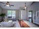 Cozy living room with a front door view, hardwood floors, comfortable seating, and natural light at 17635 Willow Creek Way, Westfield, IN 46074