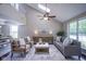 Bright living room with vaulted ceilings, a ceiling fan, and stylish furniture creating a welcoming space at 17635 Willow Creek Way, Westfield, IN 46074