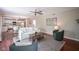 Bright and airy living room with hardwood floors, ceiling fan, and access to the kitchen at 17635 Willow Creek Way, Westfield, IN 46074