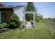 Inviting side yard features a stone path under an arbor and professional landscaping at 17635 Willow Creek Way, Westfield, IN 46074