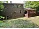 Exterior view of the brick home and lush, green lawn from the backyard at 2002 Grey Fox Ct, Martinsville, IN 46151