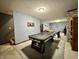 A finished basement with an air hockey table and comfortable seating area for entertaining at 2002 Grey Fox Ct, Martinsville, IN 46151