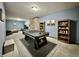 Finished basement featuring an air hockey table, stone accent wall, and built-in shelving at 2002 Grey Fox Ct, Martinsville, IN 46151