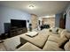 Entertainment basement featuring a large sectional couch and entertainment center at 2002 Grey Fox Ct, Martinsville, IN 46151