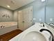 Bathroom featuring double sinks, a soaking tub, and a linen closet at 2002 Grey Fox Ct, Martinsville, IN 46151