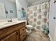 Bathroom featuring a single sink vanity, shower and blue accents at 2002 Grey Fox Ct, Martinsville, IN 46151