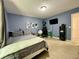 Bedroom featuring carpet flooring, a bed and blue accent walls at 2002 Grey Fox Ct, Martinsville, IN 46151