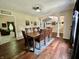 Formal dining room with beautiful hardwood floors and a large table setting at 2002 Grey Fox Ct, Martinsville, IN 46151
