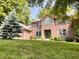Attractive brick house with lush green lawn and mature trees at 2002 Grey Fox Ct, Martinsville, IN 46151