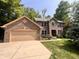 Charming two-story brick home with a well-maintained lawn at 2002 Grey Fox Ct, Martinsville, IN 46151