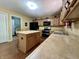 Kitchen features an island, stainless steel appliances, and plenty of counter space at 2002 Grey Fox Ct, Martinsville, IN 46151